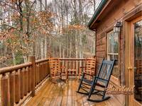 Wooden rocking chairs on the back deck with hot tub - perfect for your morning cup of coffee